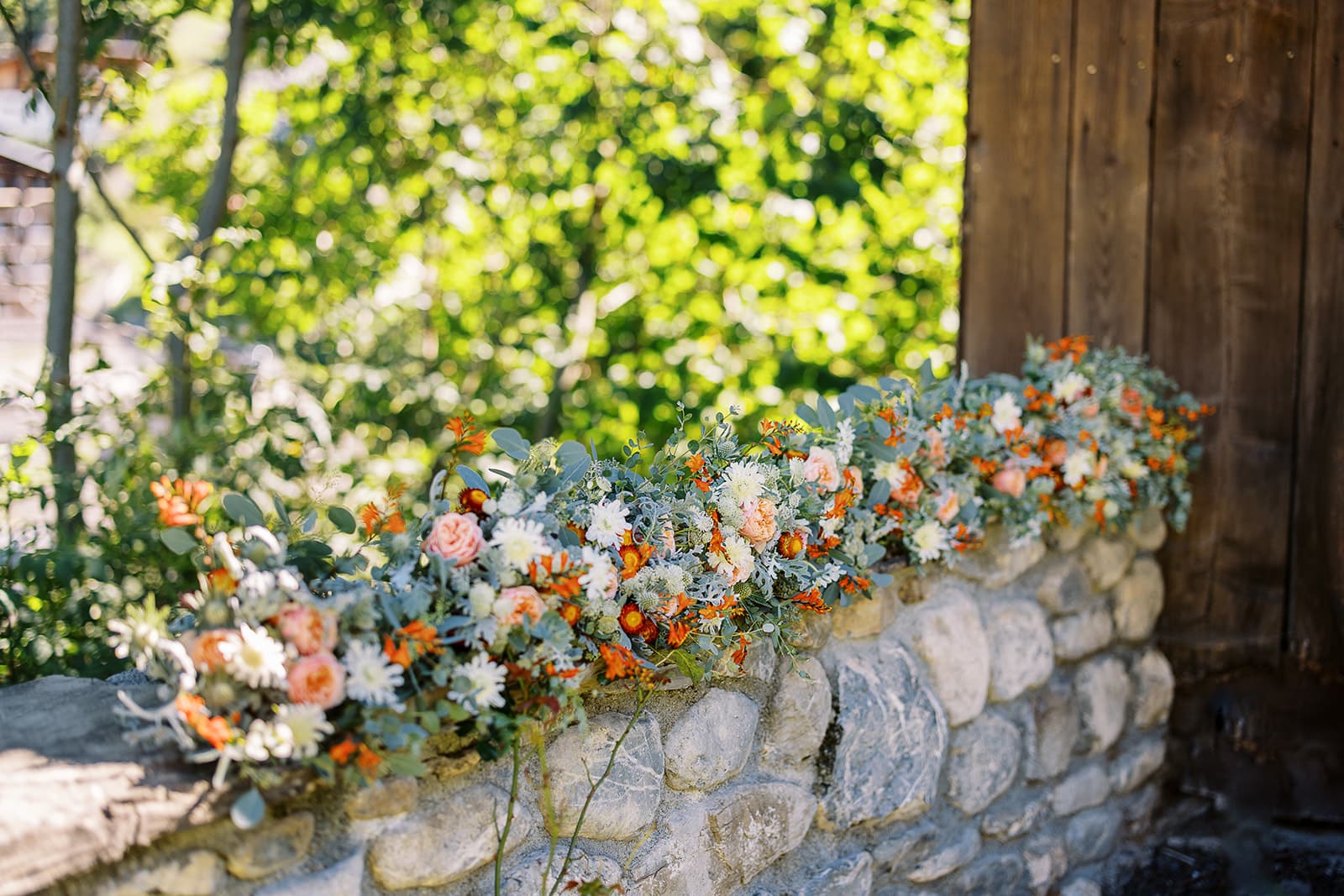 green and orange wedding bouquets in morzine