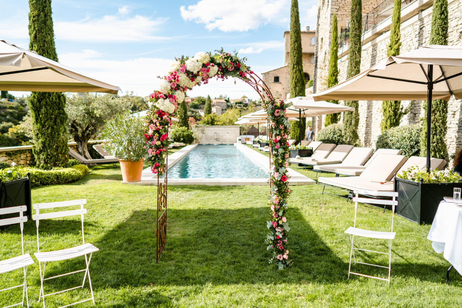 wedding arch over pool gordes bastide